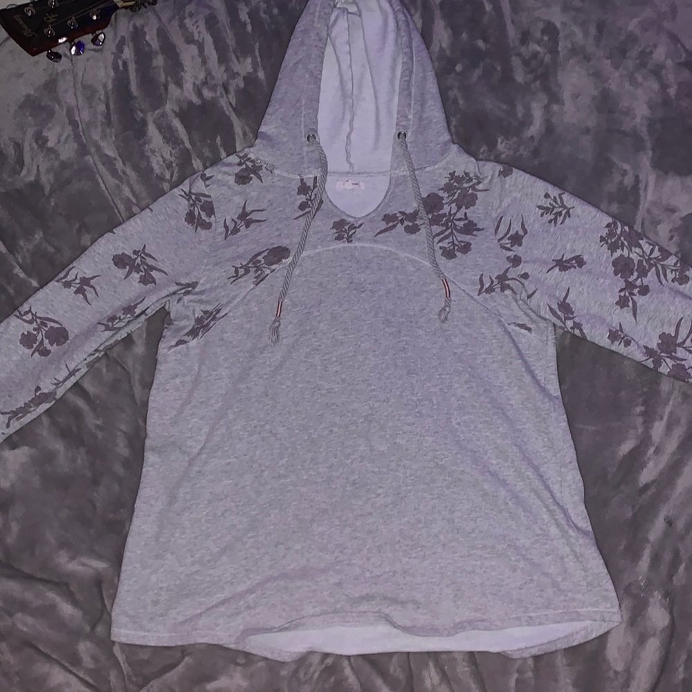 Grey long sleeve sweater with hood and lilac colored flowers